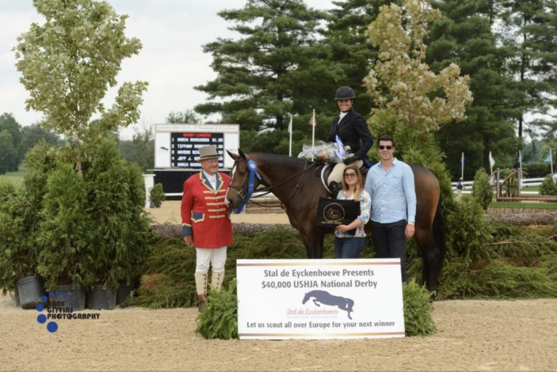 John Franzreb with sponsors Maxime Tyteca and Niels Haesen from Stal De Eyckenhoeve present the award to Maria Rasmussen and Connor for their win of the $20,000 Open Section of the USHJA National Hunter Derby.Photo by Anne Gittins Photography