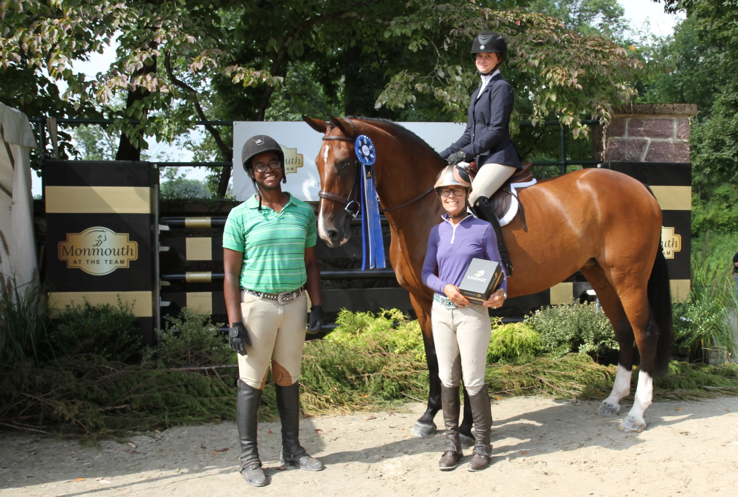 Carmella Cacciatore won Wednesday's Sportsmanship Award and was presented with a pair of Lineage stirrups. She is aboard Catherine the Great with Charles Brown and Penny Kinnally. Photo by EQ Media