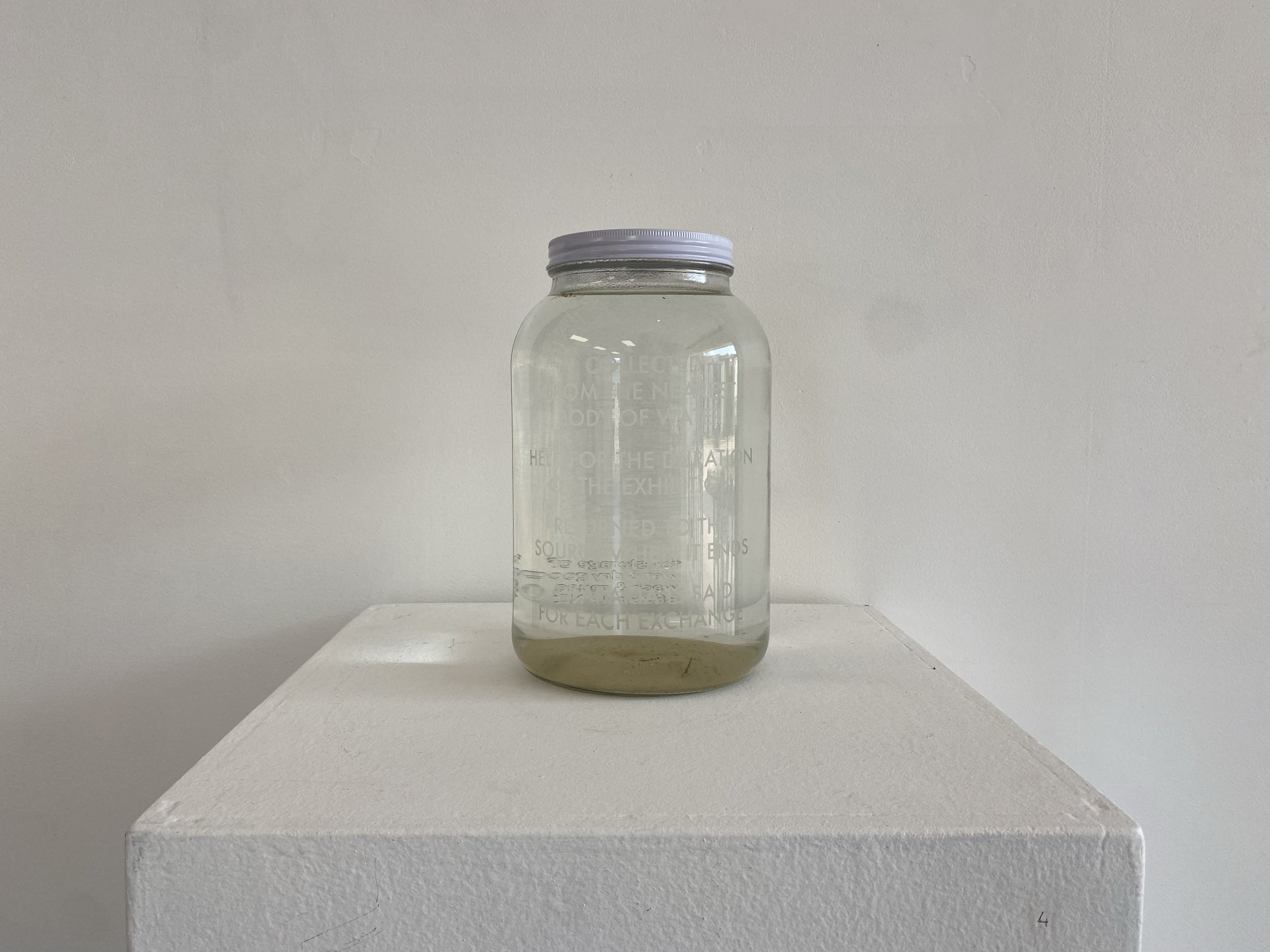 Held, 2021, etched glass and water collected from the nearest source 