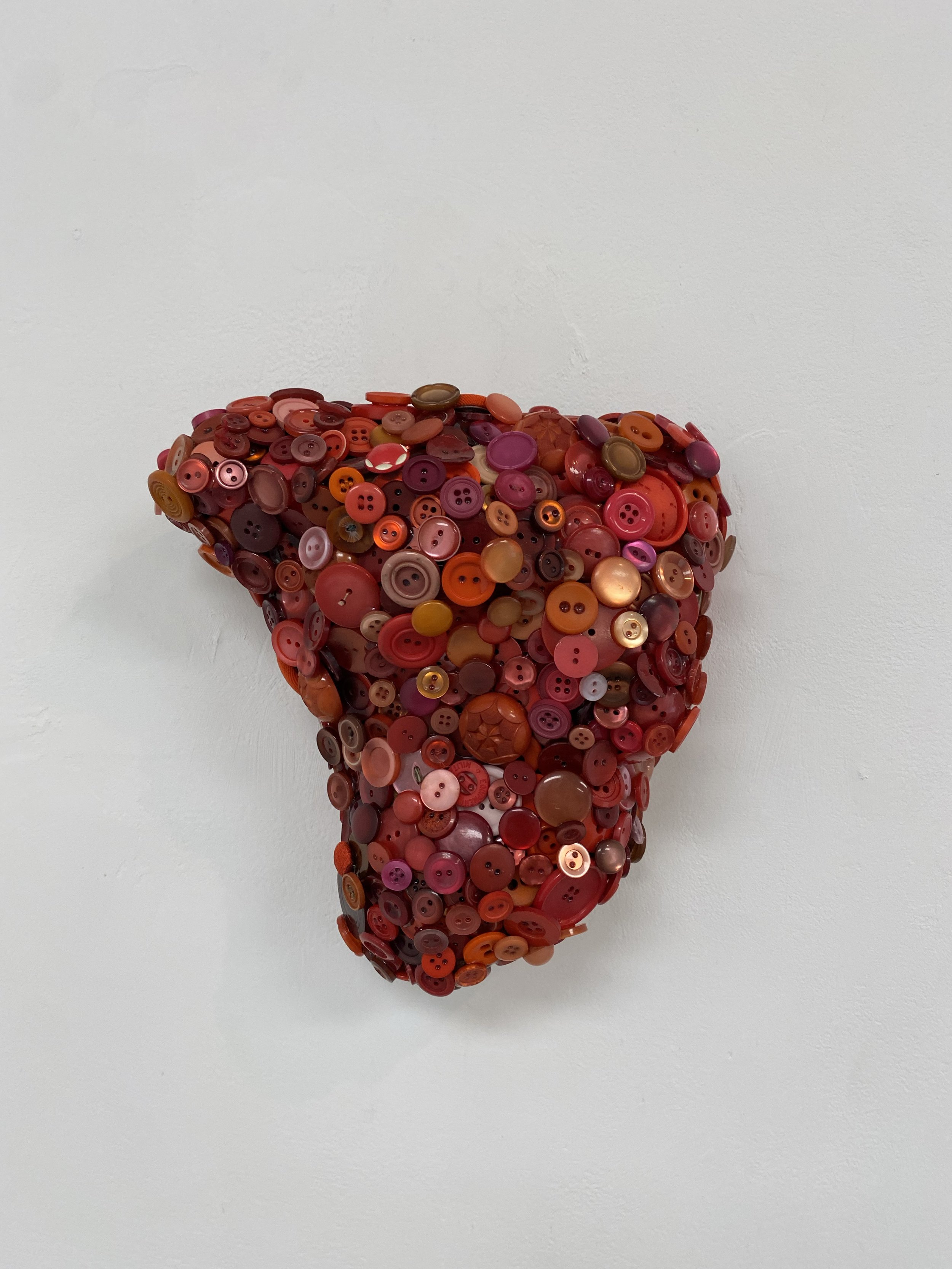 Ox Heart, 2022, found buttons on found wood, 
