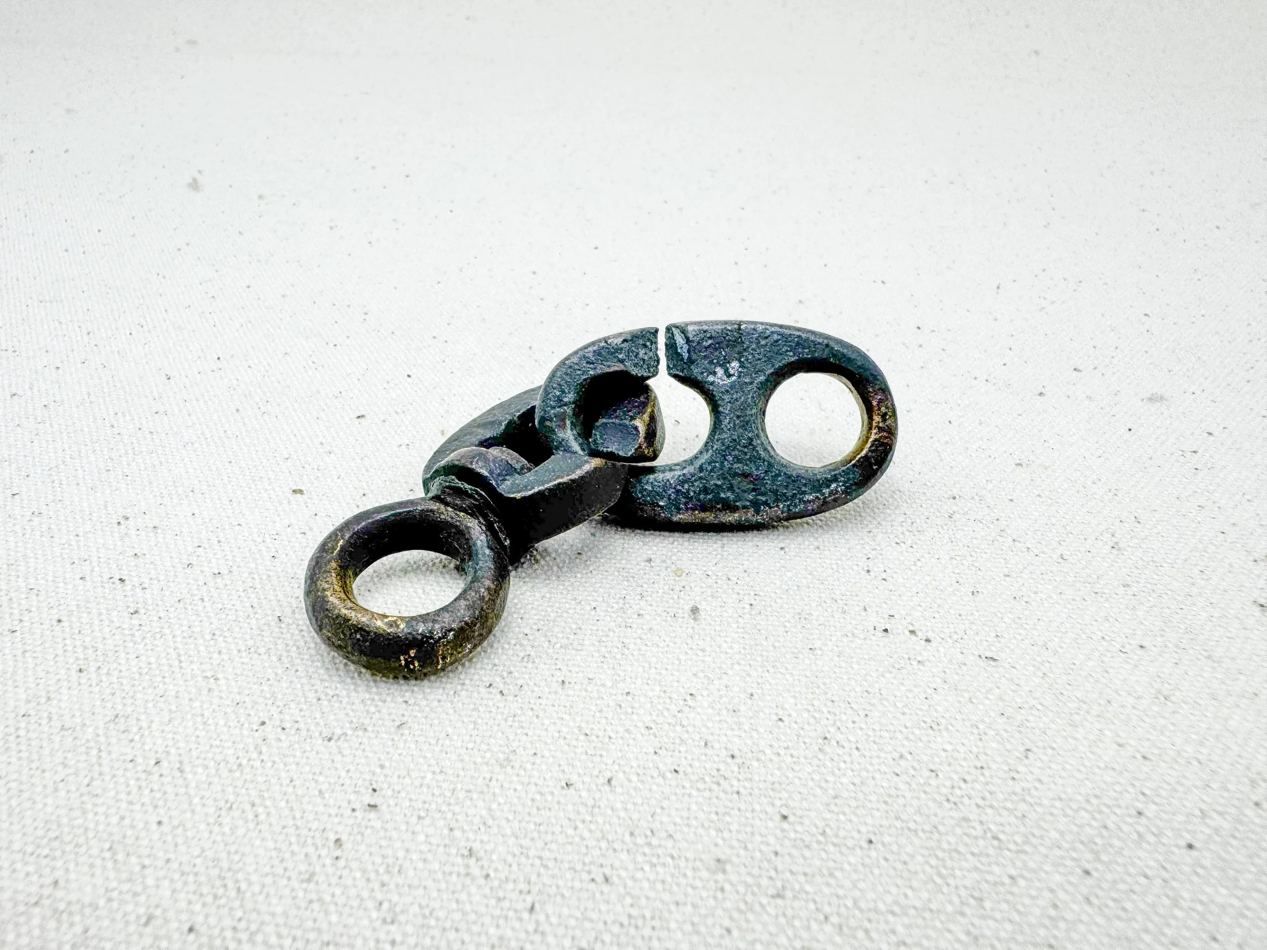 An Inglefield clip and a Brummel hook, (seperated)