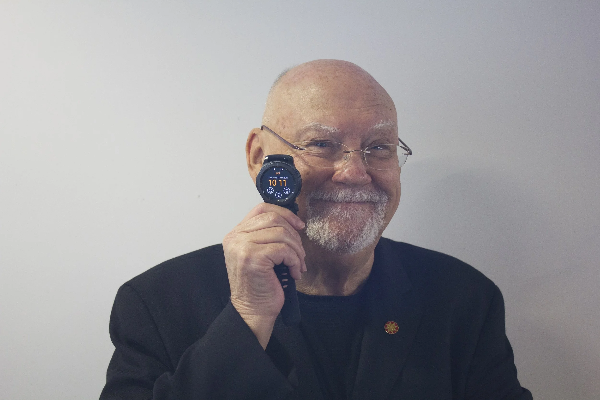 Sir Ray Avery holding the Jupl Safety Watch