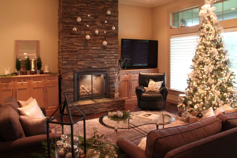 In the living room, we used the owner's existing leather recliner and glass table and brought in custom chosen couch and love seat, plus silver accent rug, throw pillows and Christmas decor courtesy of local providers.