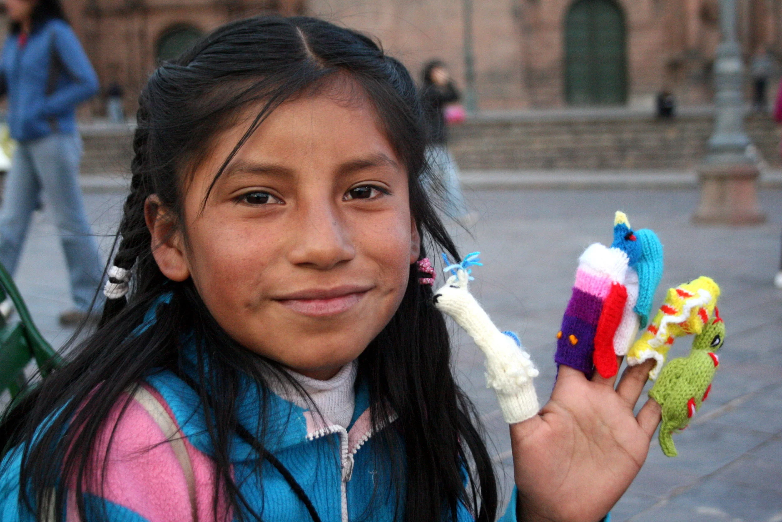  A girl selling finger puppets in the Plaza de Armas in Cusco, Peru. 2010.&nbsp; 