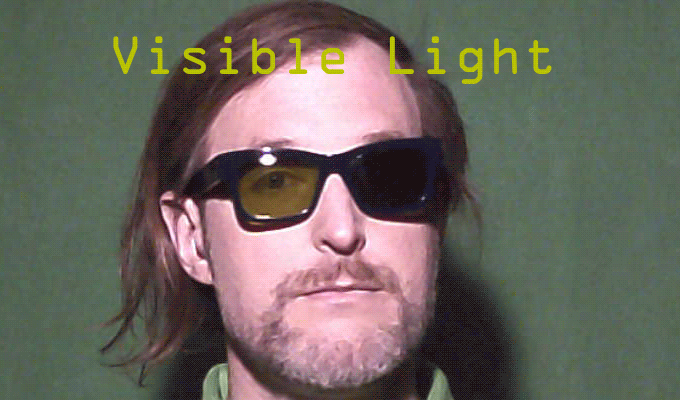On left side is an IR-lens and on the right is a regular sunglasses lens. When infrared is used, the IR-lens turns black while the regular sunglasses lens becomes clear.