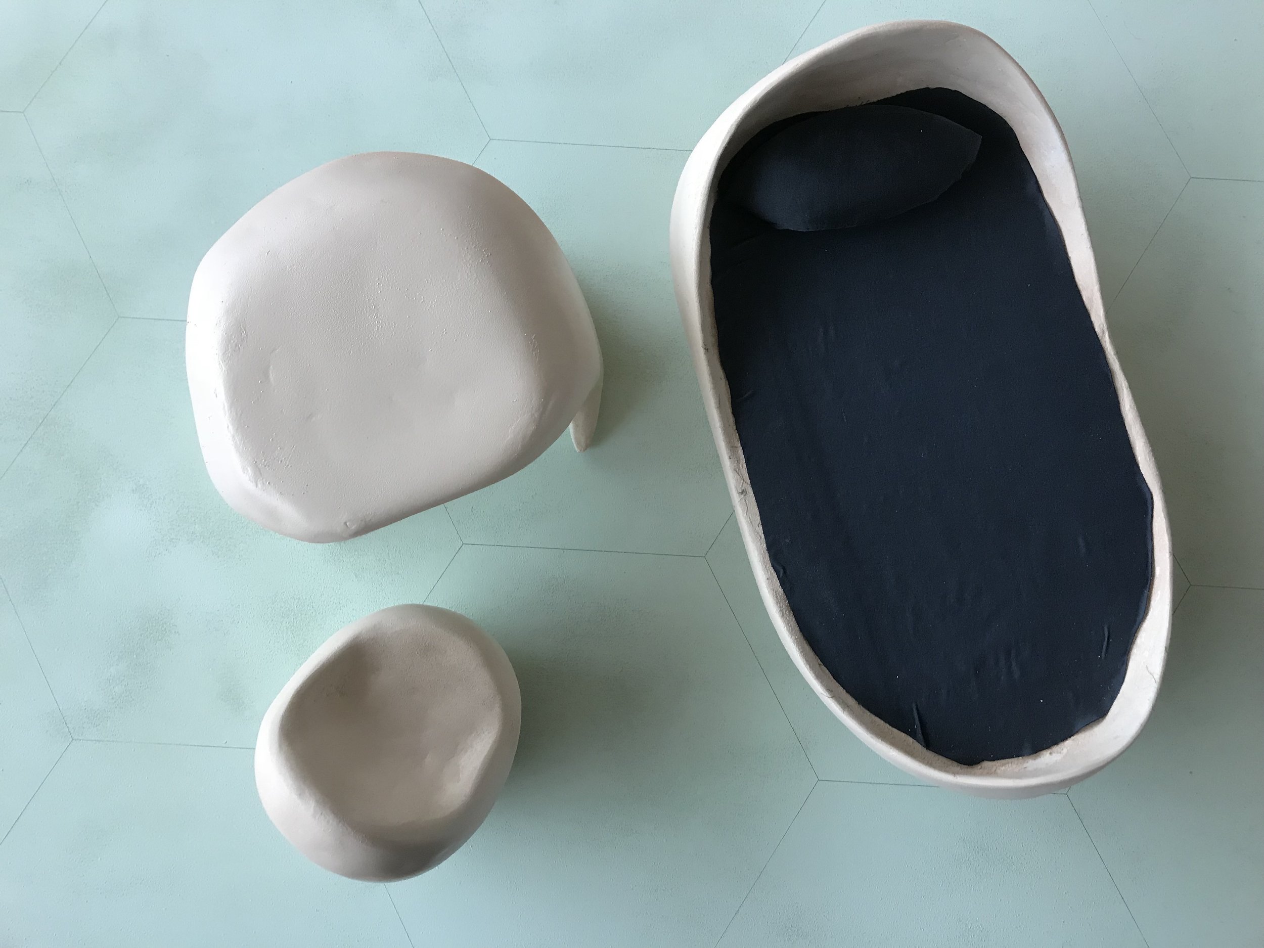 Furniture made with blue foam covered in paper clay.