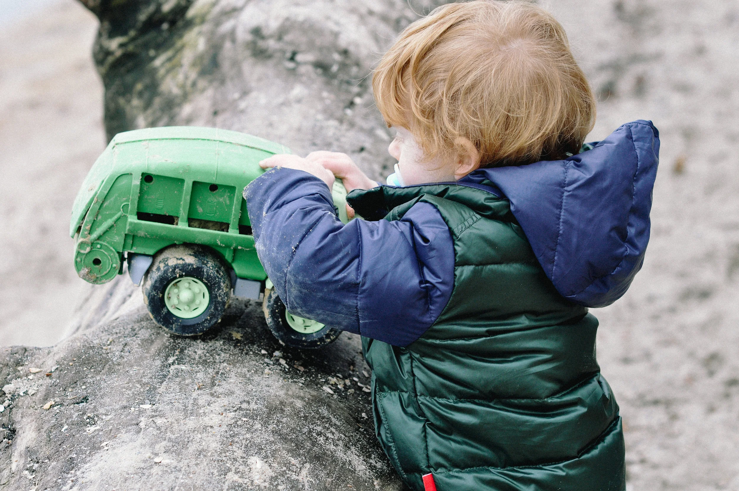 chesapeake beach family session truck on a log