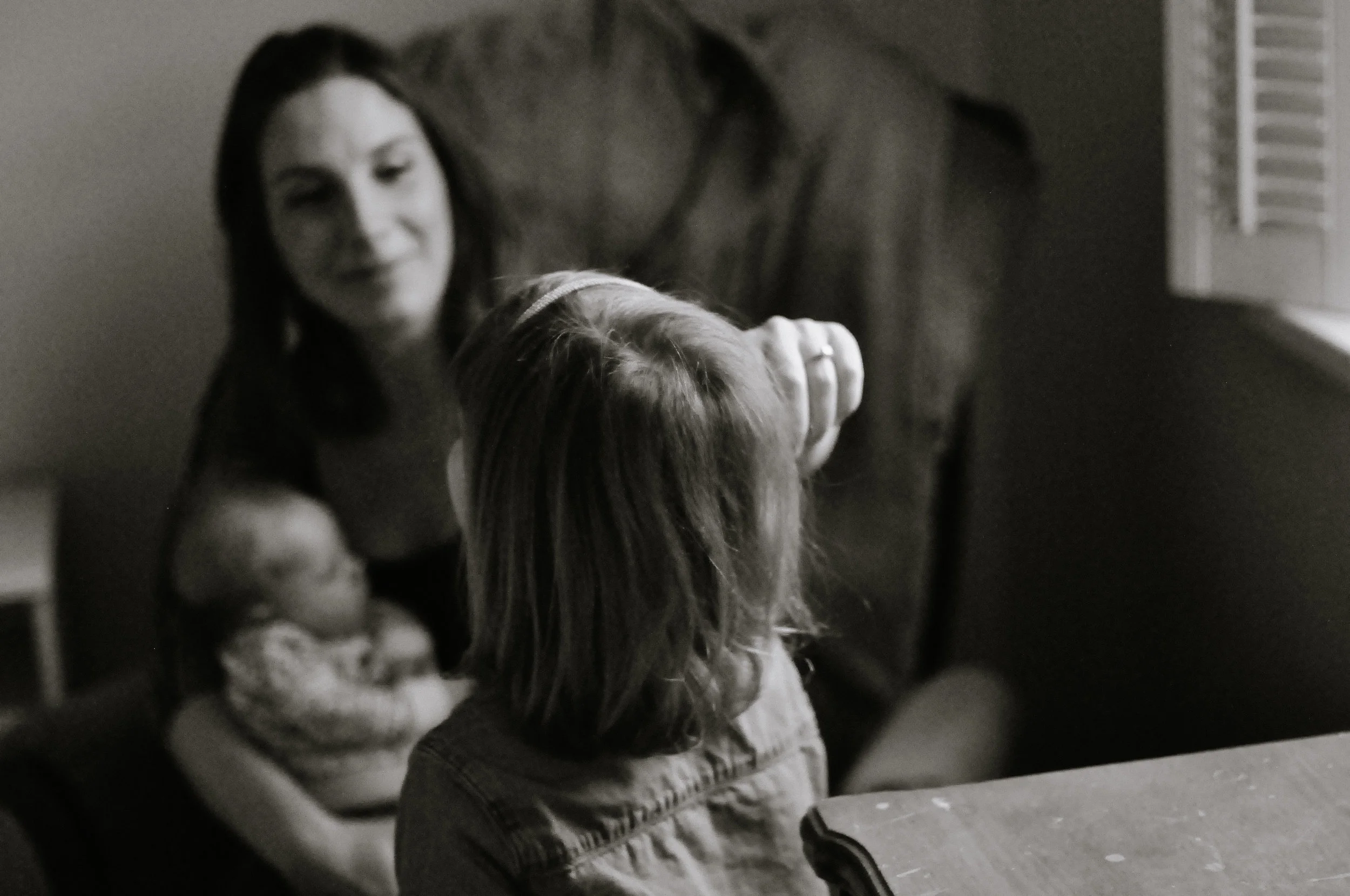 mom brushing the hair back
