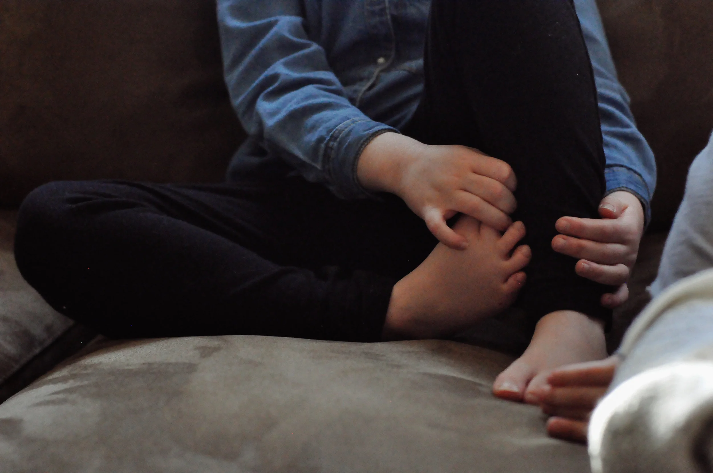 little hands holding little toes