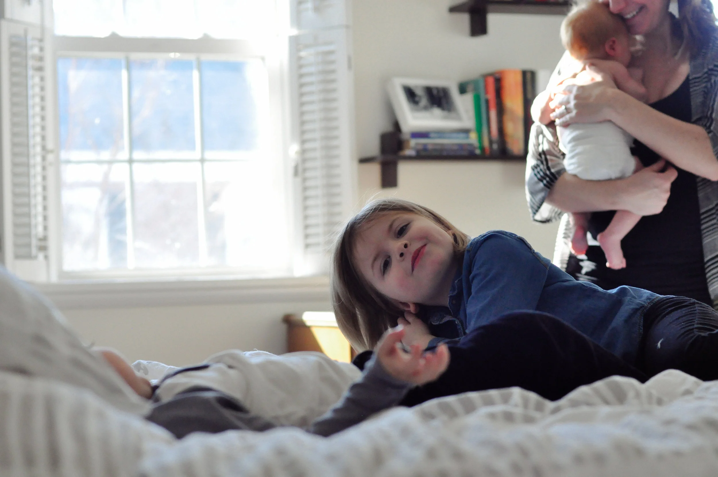 family of five on bed