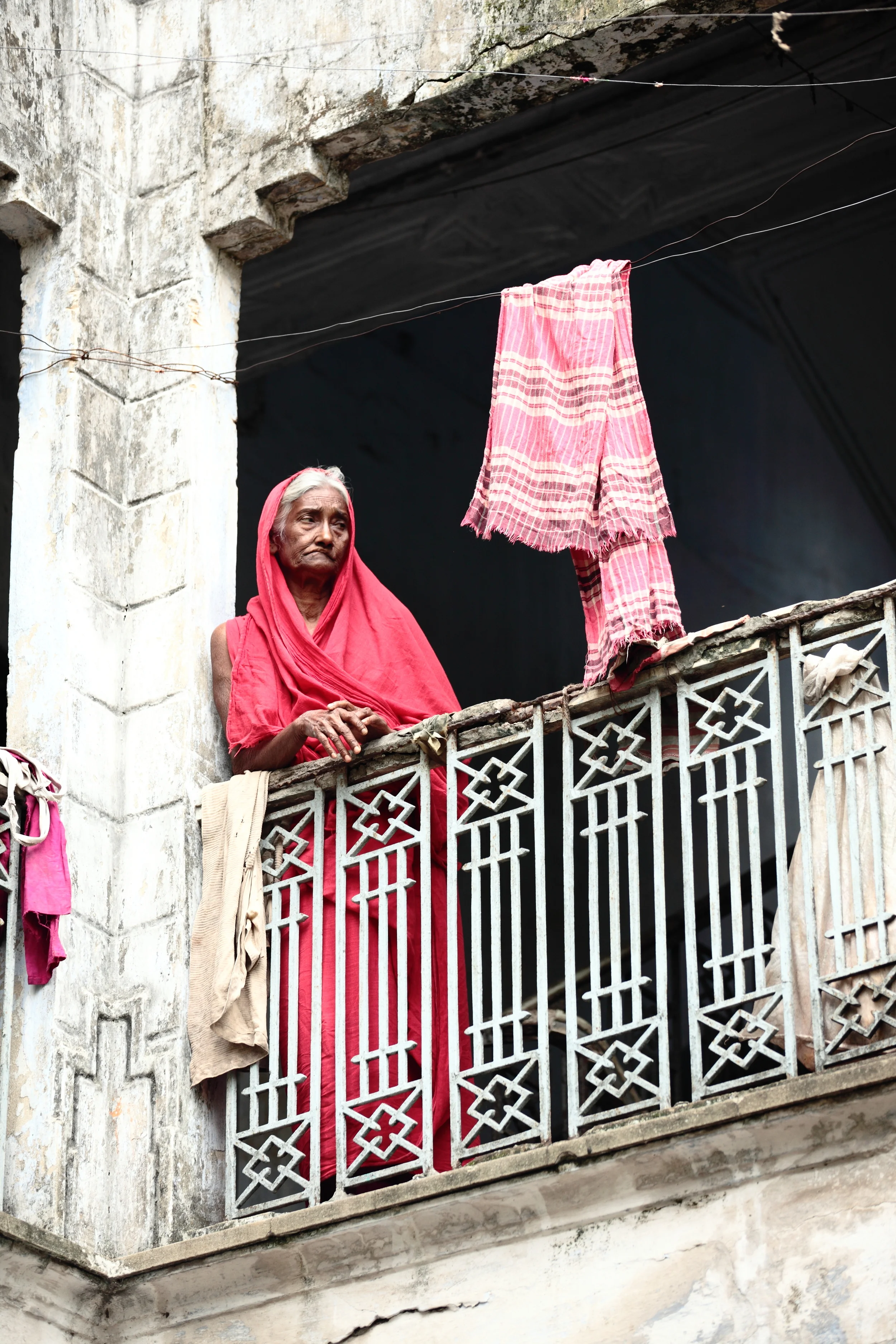  An old women in an Old Dhaka beautiful building 
