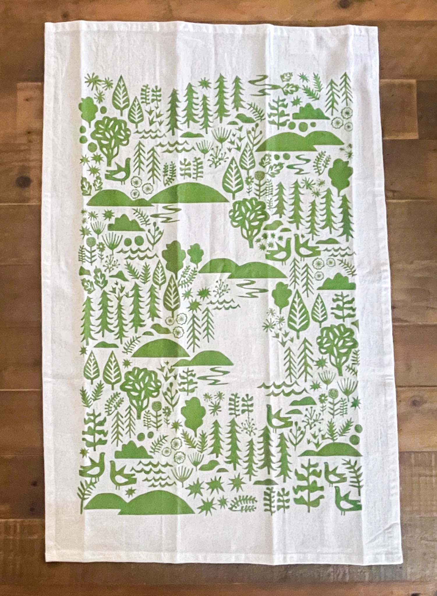 Jen Judd McGee's Little Long Pond Flour Sack Tea Towel with a playful scene, adding a pop of color and whimsy to your kitchen