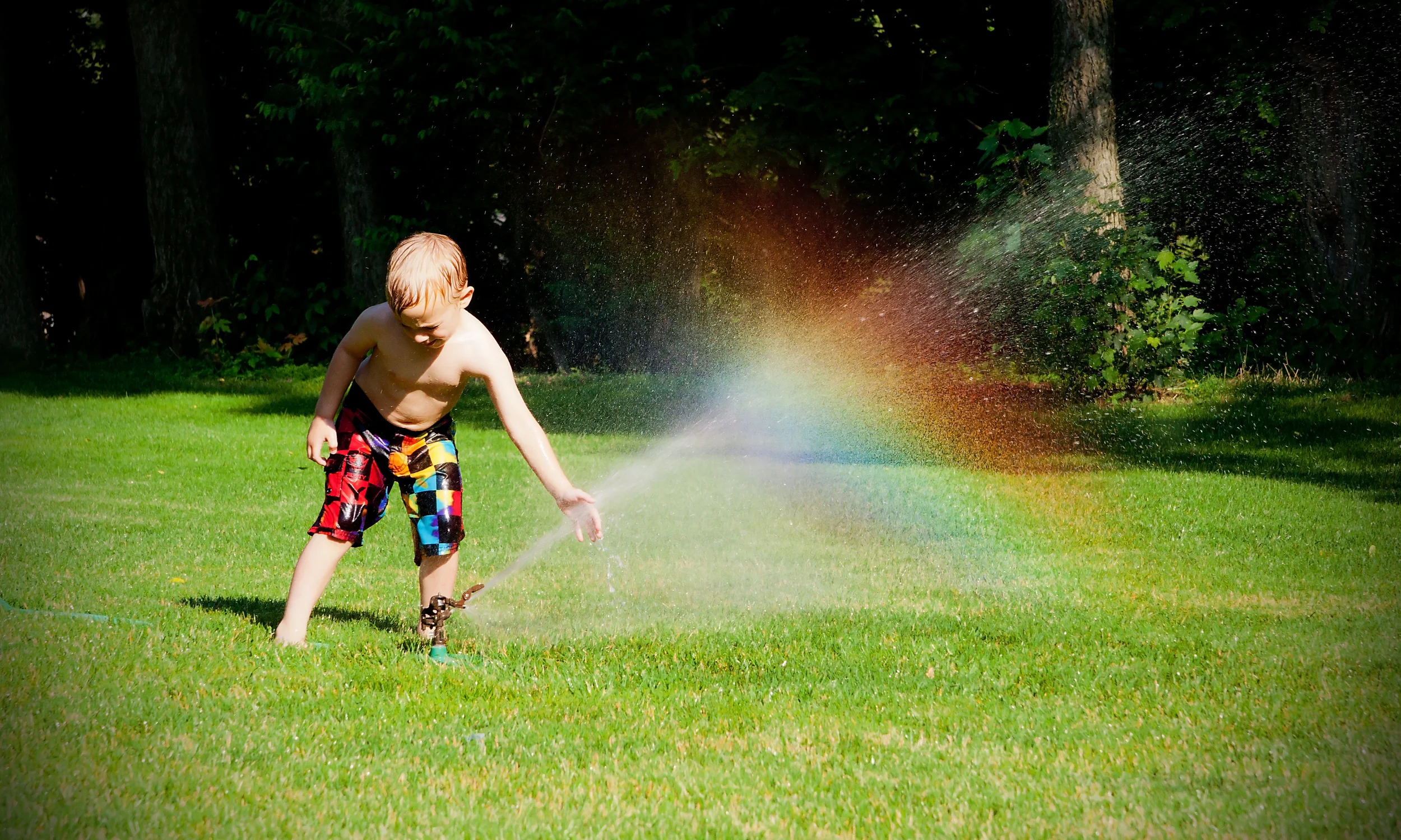 summertime sprinkler fun rainbow action.jpg
