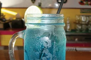 Aruba Restaurants - Blue Curaçao Cocktail Served in a Mason Jar, Smokey Joe’s Island Grill