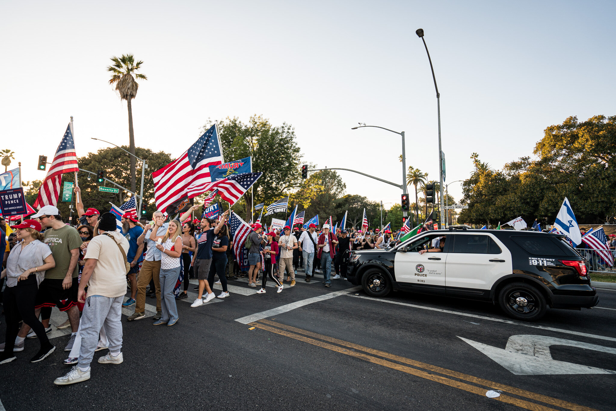  With just over twenty-four hours until election day, Trump supporters assembled in Beverly Hills, California on 11/1/2020. The group stationed themselves on Santa Monica Boulevard, and then proceeded to march down Beverly Blvd. and Rodeo Drive to sh