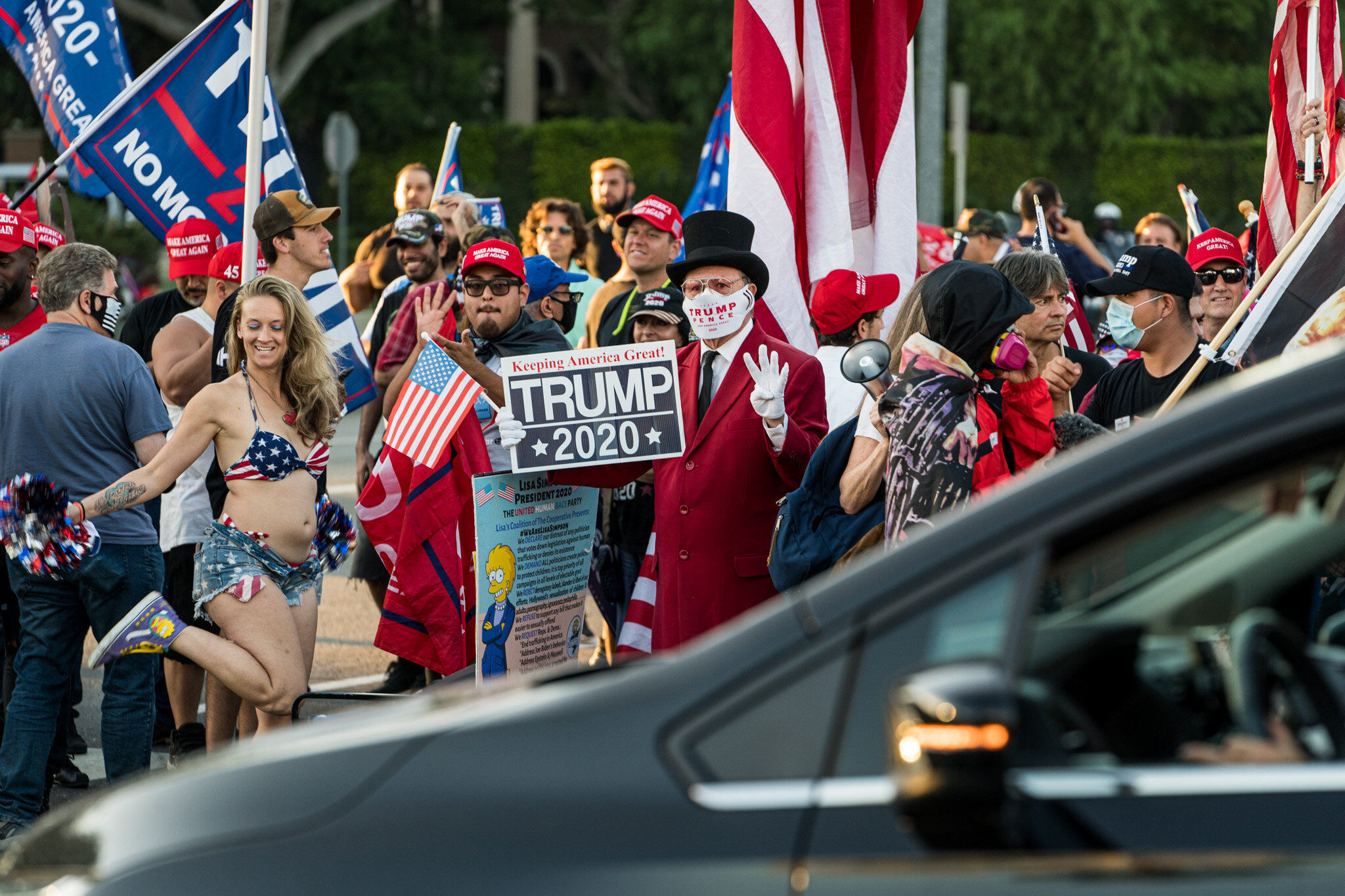  With just over twenty-four hours until election day, Trump supporters assembled in Beverly Hills, California on 11/1/2020. The group stationed themselves on Santa Monica Boulevard, and then proceeded to march down Beverly Blvd. and Rodeo Drive to sh