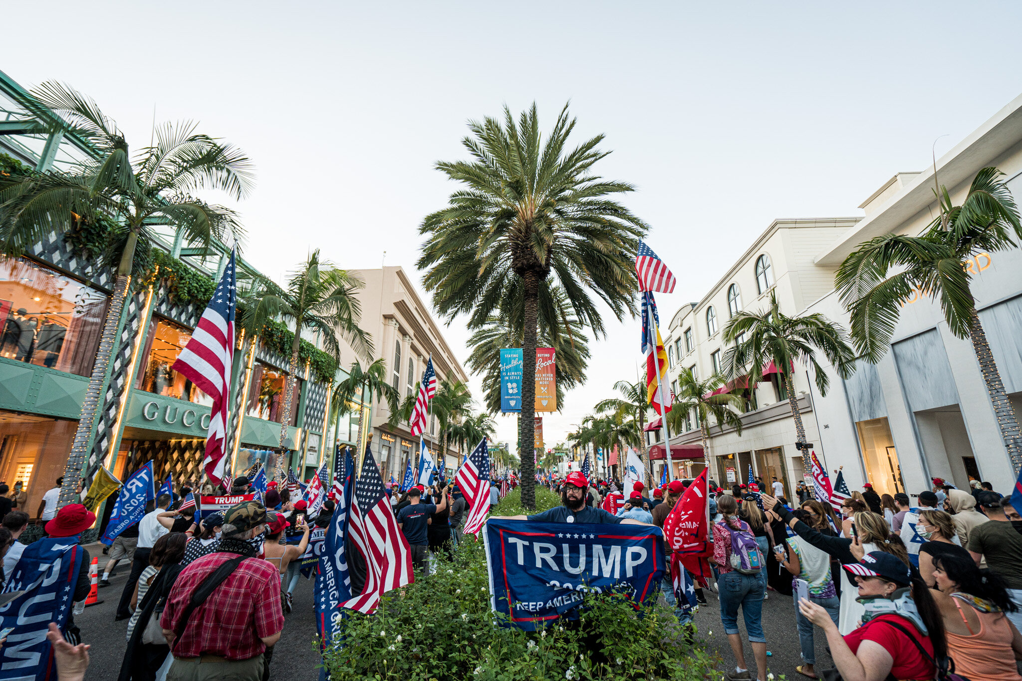  With just over twenty-four hours until election day, Trump supporters assembled in Beverly Hills, California on 11/1/2020. The group stationed themselves on Santa Monica Boulevard, and then proceeded to march down Beverly Blvd. and Rodeo Drive to sh