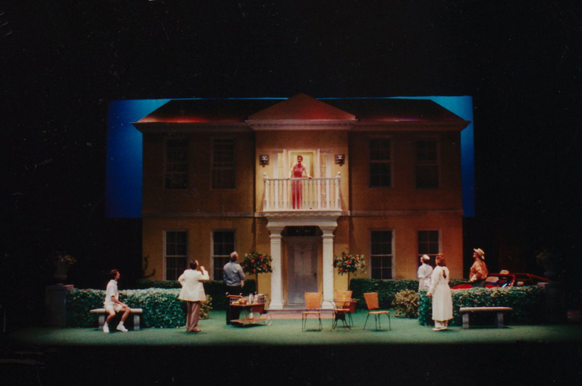 This production had the same principal ideas in a different setting. The garden grew out of the ground and flowers grew out of the hedges. The sconces still glowed when needed. And that is a Ferrari parked at the house!