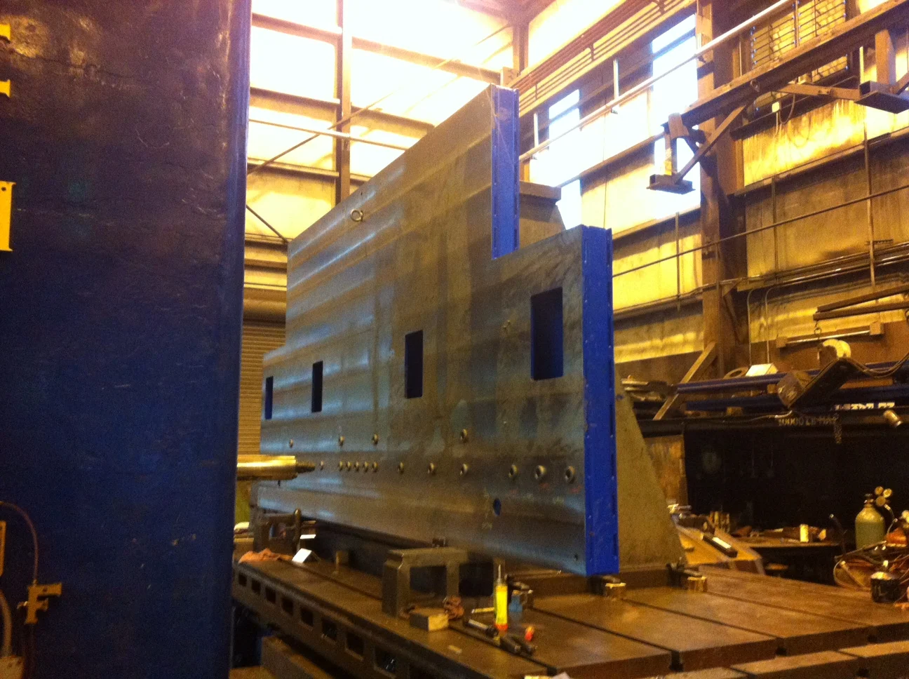 Careful machining after stress relief and paint to assure flatness and final result in tolerance.