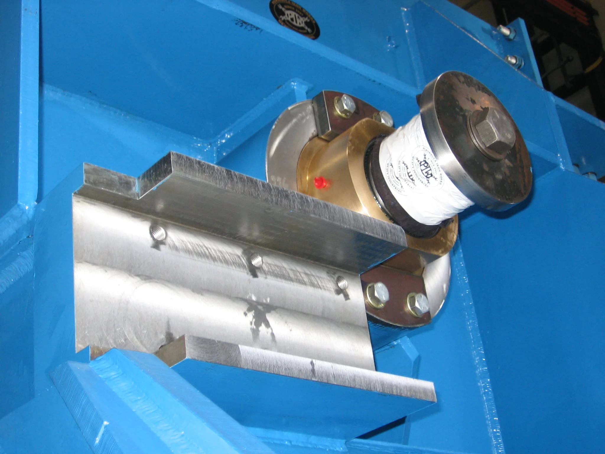 Close up of machined features and assembly details on a large machine component manufactured complete.