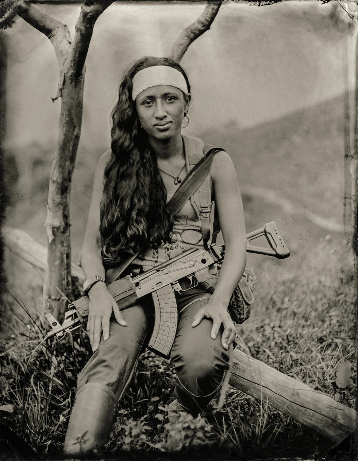 Maritza - By: Zach Krahmer www.zachkrahmer.com I made my first plates in mid-2016 during a one day workshop with Portland based photographer Ray Bidegain The image of Maritza comes from, and represents a larger series of 80 plates of the 53-year old Colombian guerrilla army, FARC, in the early weeks of 2017 before they formally demobilized. The plates were made within various camps in remote areas of the mountainous Andean jungle, that were only accessible by mule. I chose to make this work because the narrative presented in the news is simple, and I wanted to learn about the complex and dynamic motivations of individuals on this side in the Colombian Civil War. I chose to work with collodion because the process engages the sitter with the photographer, and requires collaboration. Whether securing access, acquiring chemistry in a remote area, or innovating ultra mobile set ups, the series took international coordination between many groups of people in order to happen. Be sure to check out Vela Colectivo, who secured access, and Camilo Sabogal who assisted with acquiring chemicals in Colombia.