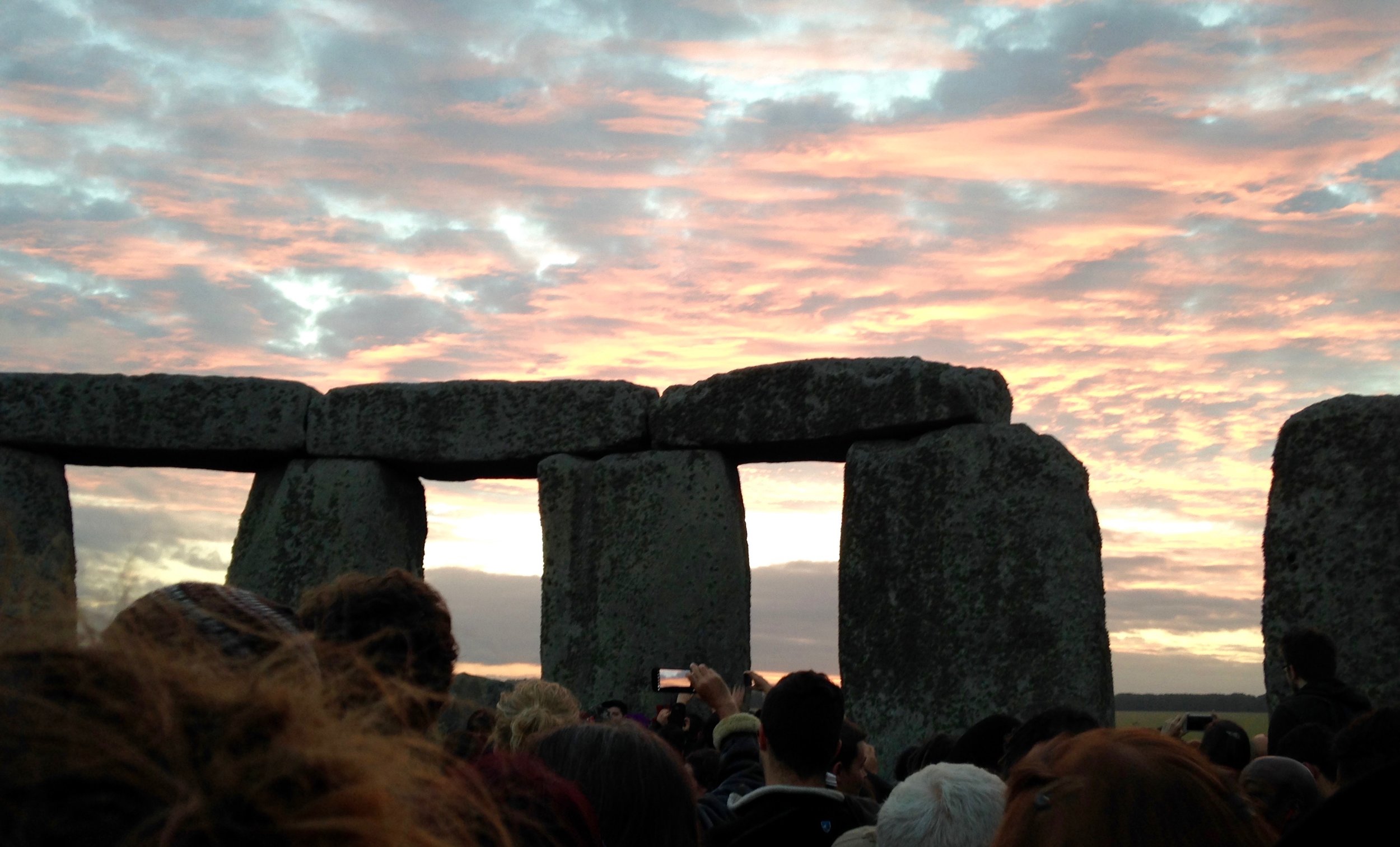 Summer Solstice sunrise at Stonehenge, viewed with ten thousand others.