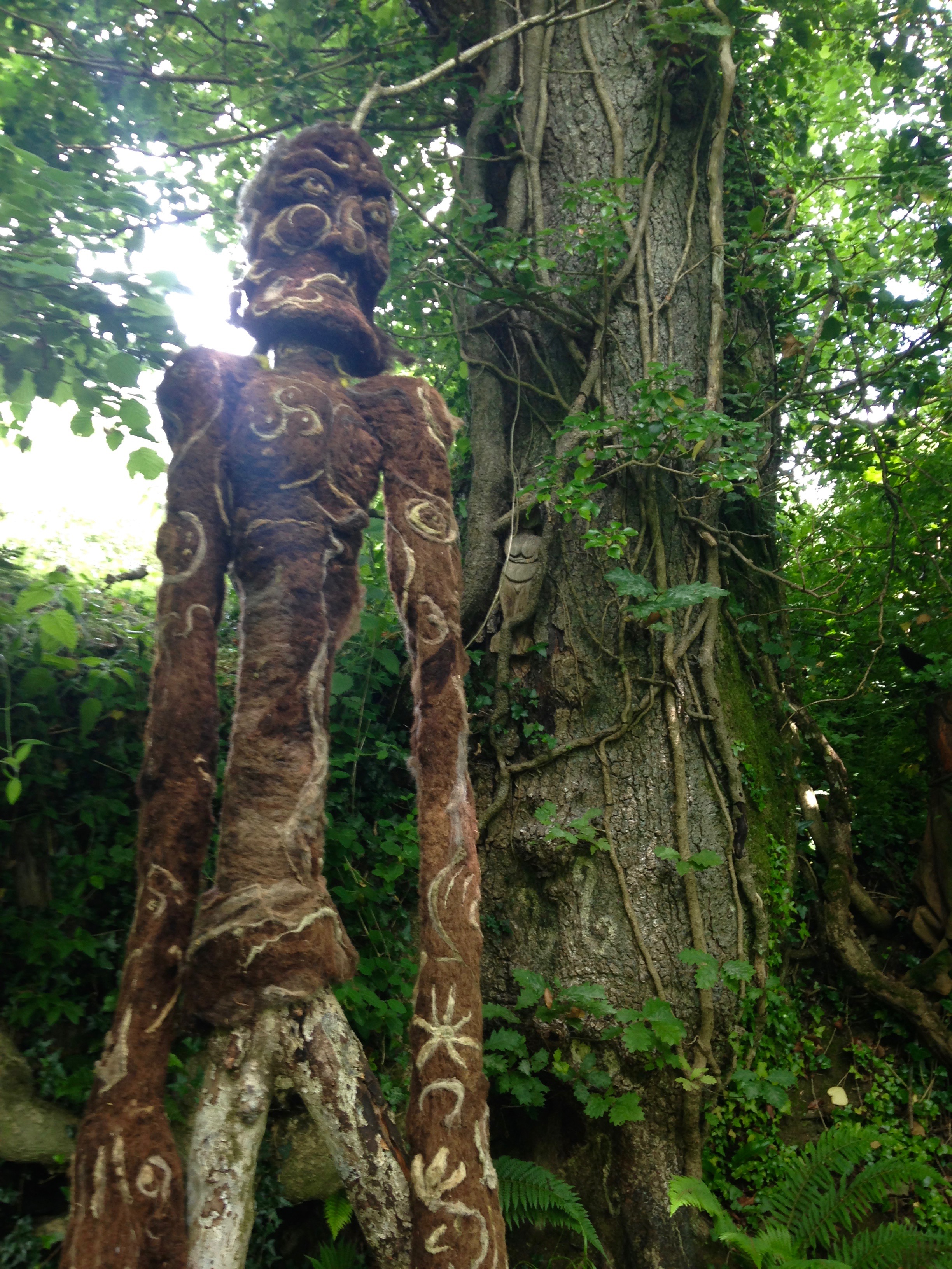 A tree spirit near Castell Henllys, a 2,000 year old Celtic hillfort in Wales. If you look closely, you can see a female icon on the tree.