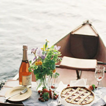 This canoe picnic engagement shoot on Green Wedding Shoes .