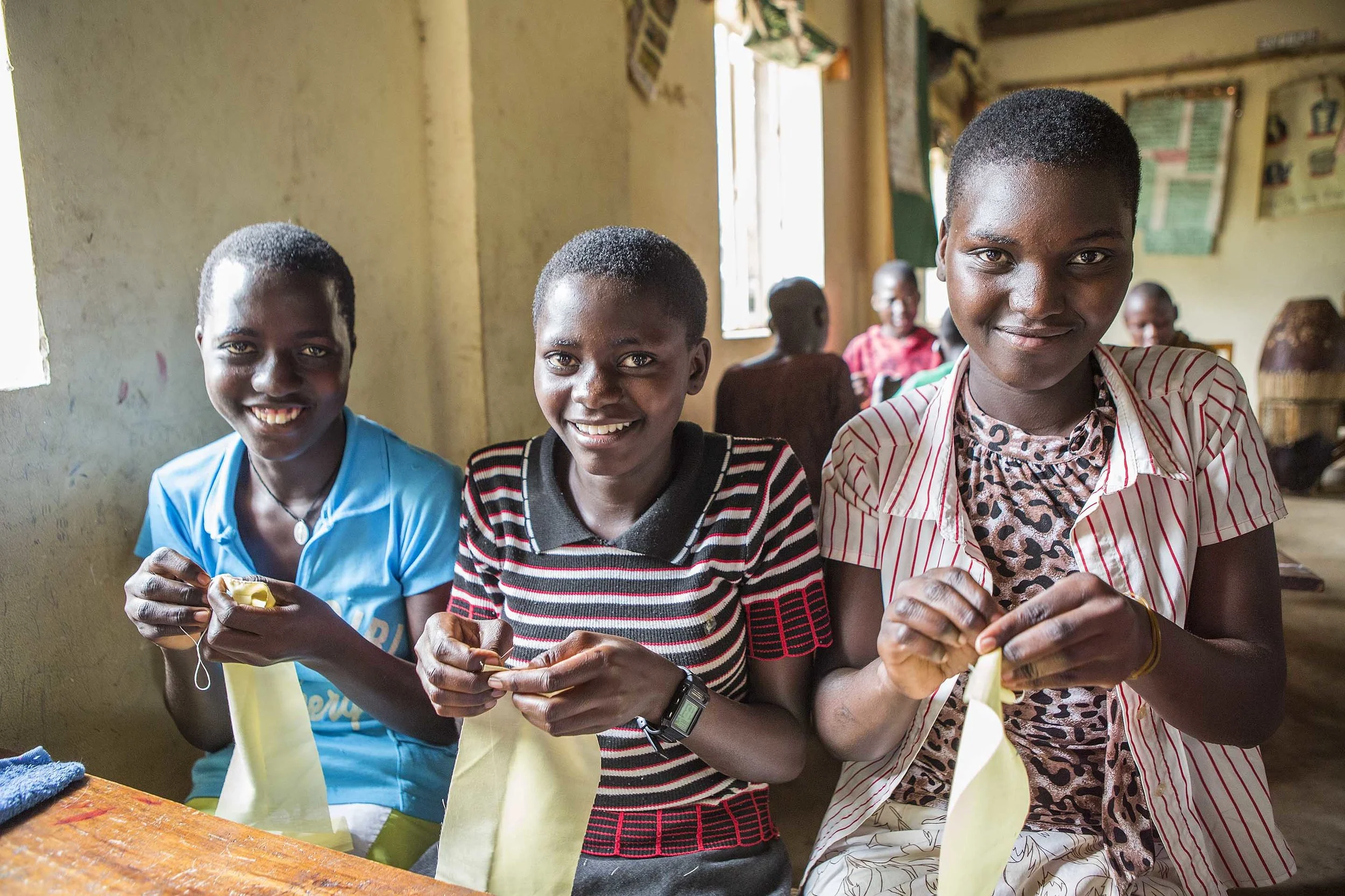  Young women learning to make their own set of reusable menstrual pads
