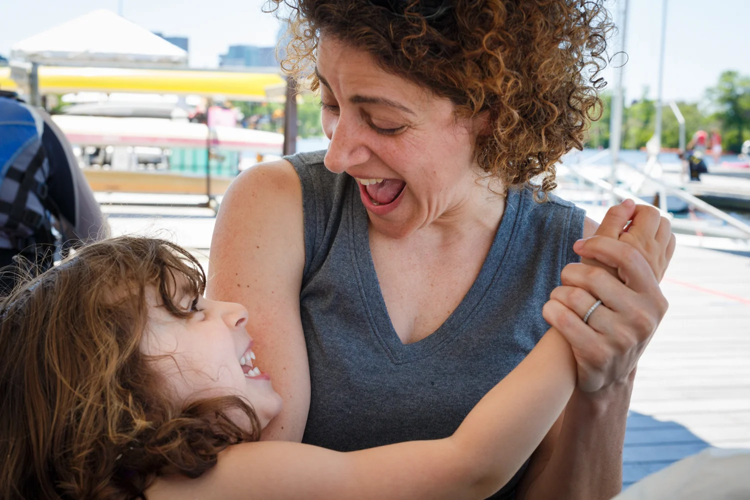 Giggles for desert - Ali and Chelsea are being silly during our picnic on the dock at the community boating center.
