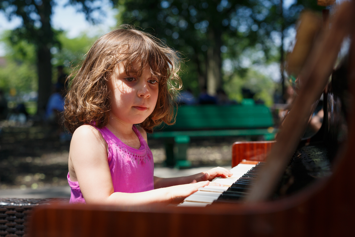 This is Chelsea's first performance at the Hatch Shell. Definitely an un-expected sight to see this very weathered piano next to some park benches. Chelsea jumped at the chance to play the oddly tuned and badly warped piano. 