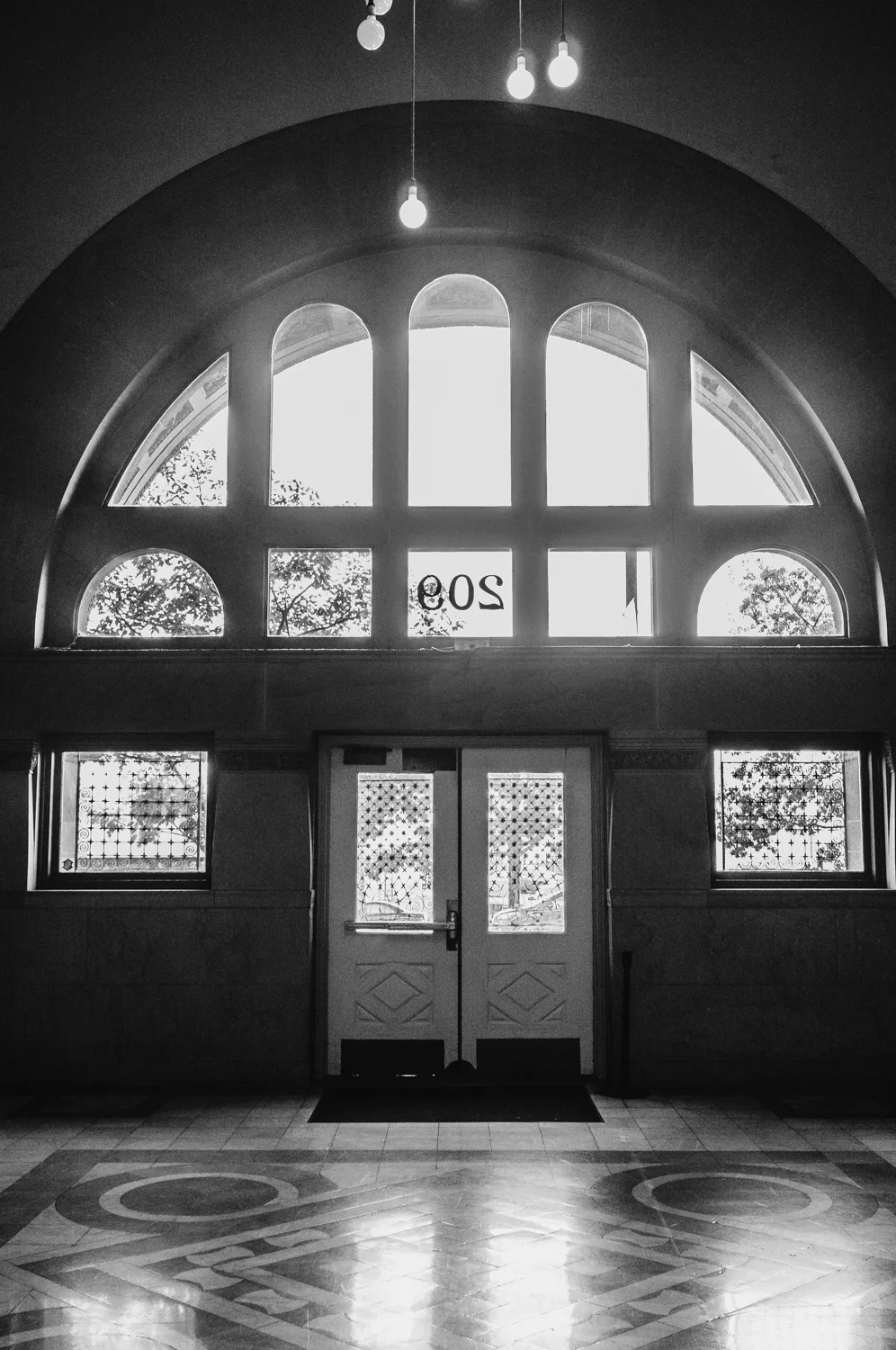 This was once the main entrance to our building... Now, it now acts as a sort of back room and you can only leave through these doors. It has all the markings of a grand entrance, but no one really enters this way any more. Kind of sad. 