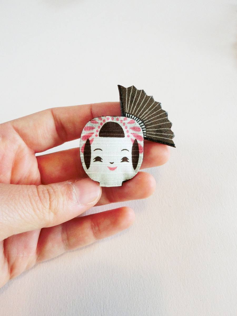 Cute brooch with kokeshi doll face