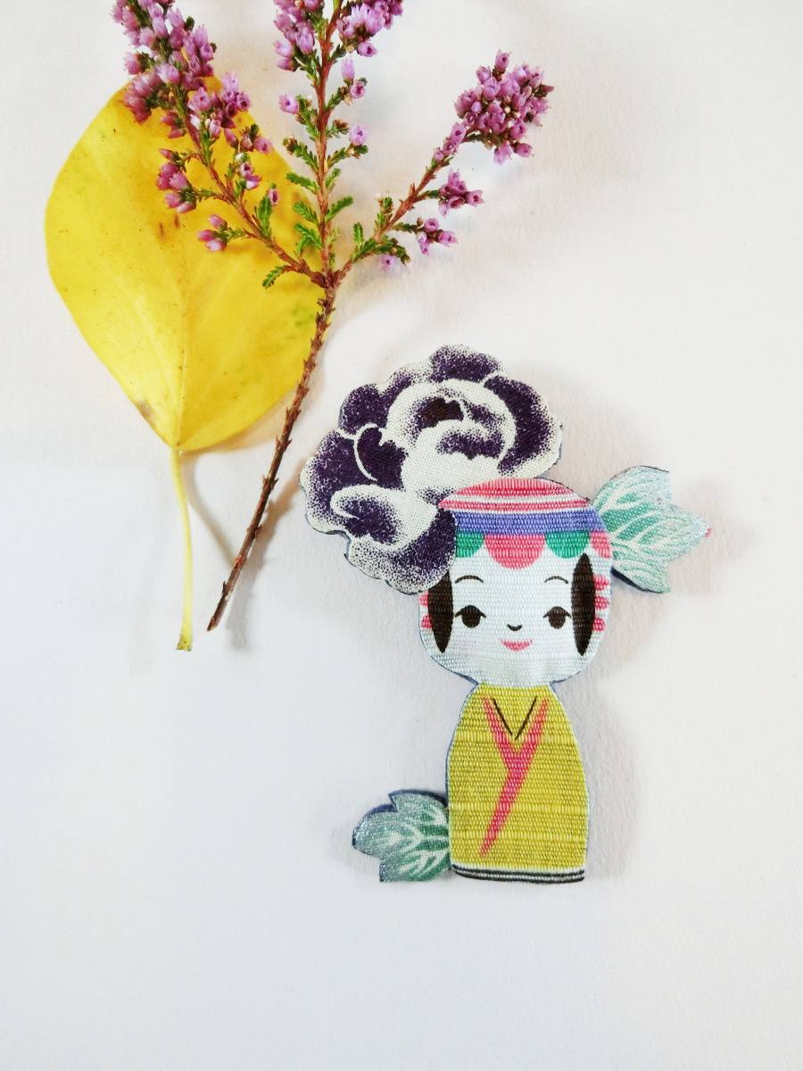Colorful brooch with kokeshi doll