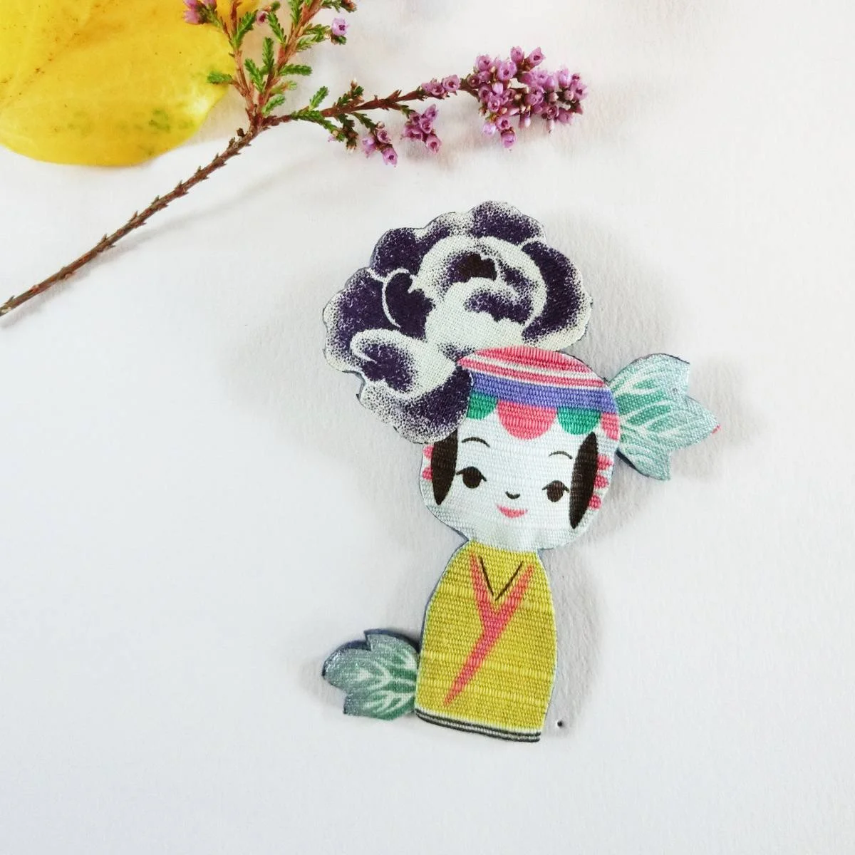 Colorful brooch with kokeshi doll