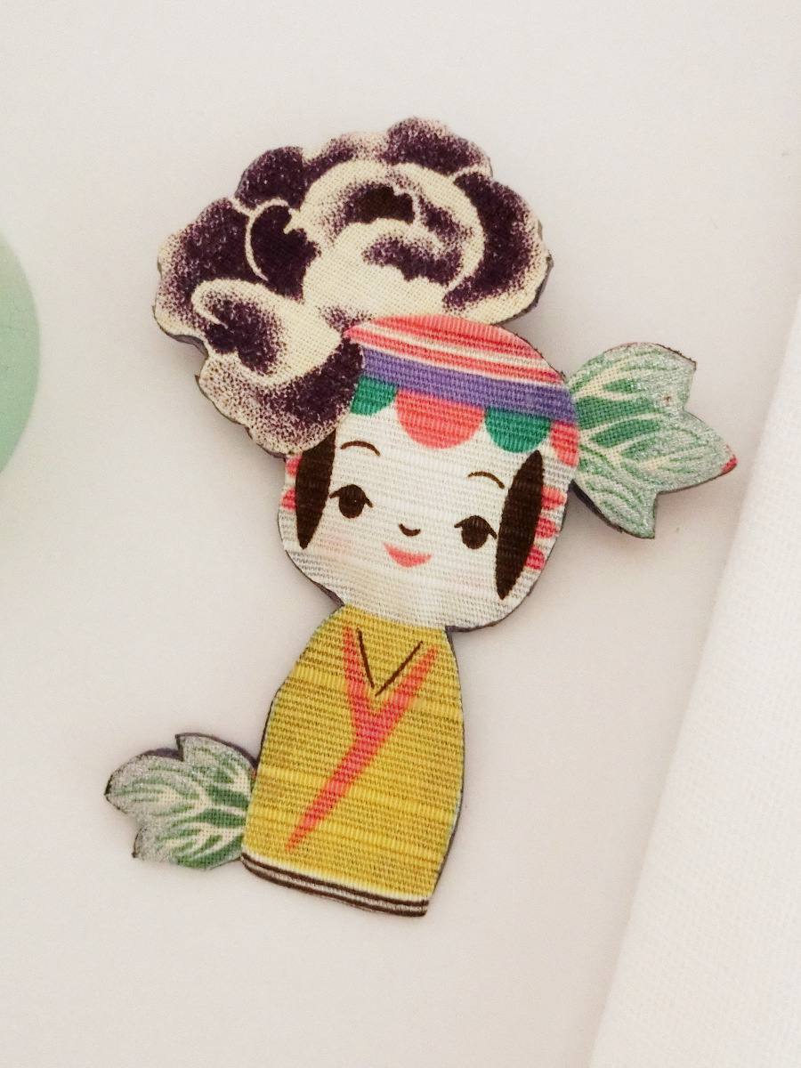 Colorful brooch with kokeshi doll