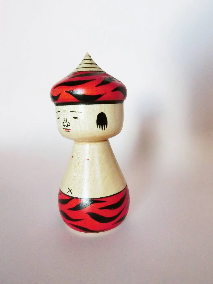 Oni-chan kokeshi doll in red