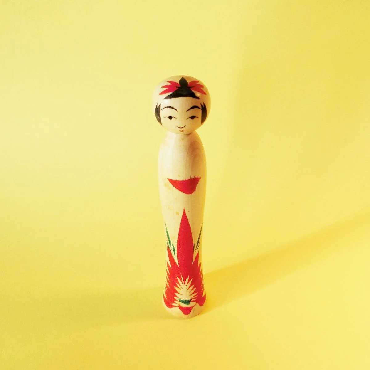 Tiny kokeshi doll in traditional, Naruko style