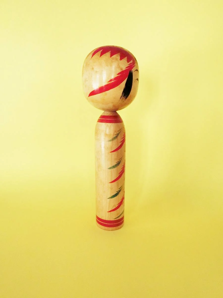 Vintage kokeshi doll in Togatta style