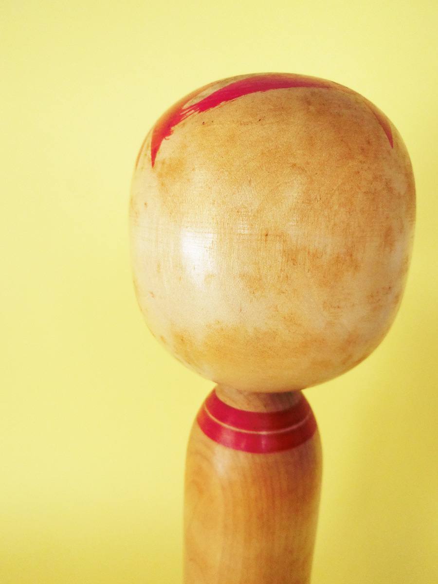 Vintage kokeshi doll in Togatta style