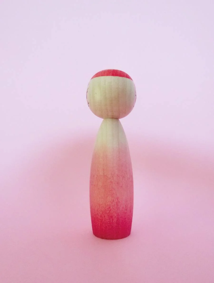 Ombré kokeshi doll by Sato Yusuke (pink)