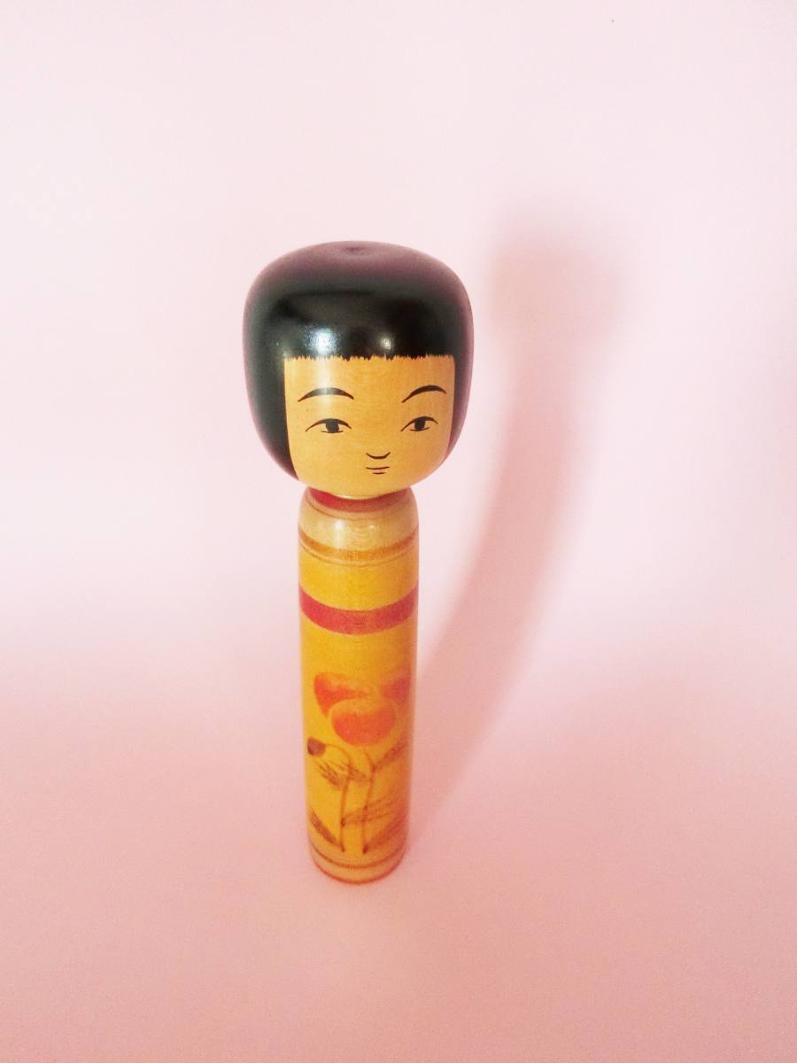 Yellow Tsugaru kokeshi by Hasegawa Kenzo