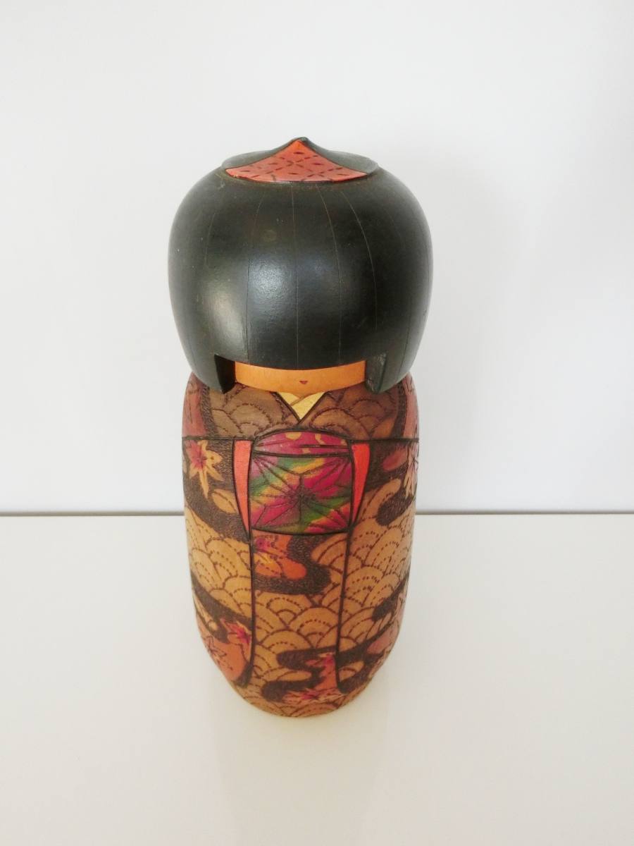 Intricate kokeshi doll by Kobayashi Inosuke