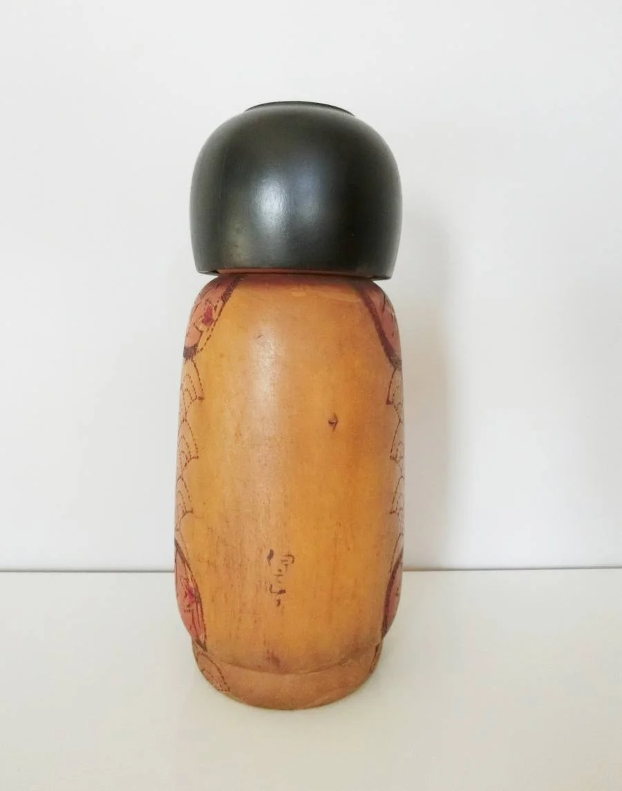 Intricate kokeshi doll by Kobayashi Inosuke