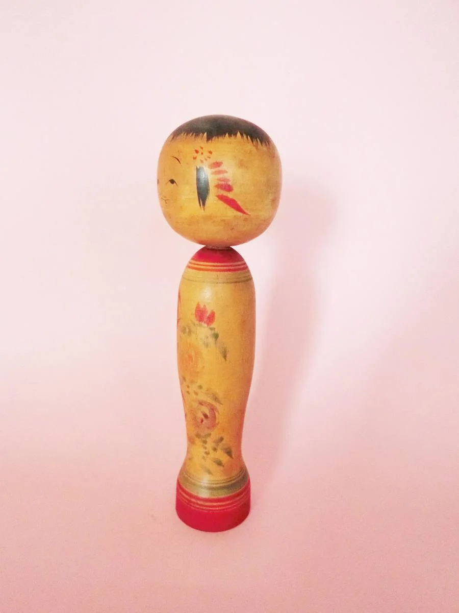 Roses kokeshi doll by Ishiyama Sanshiro