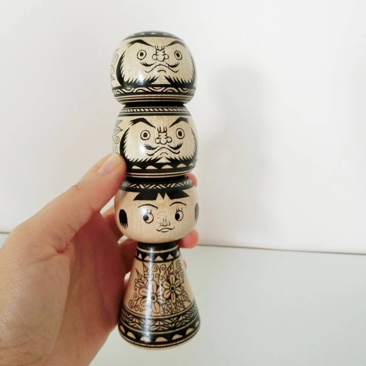 Kokeshi + daruma totem, in monochrome