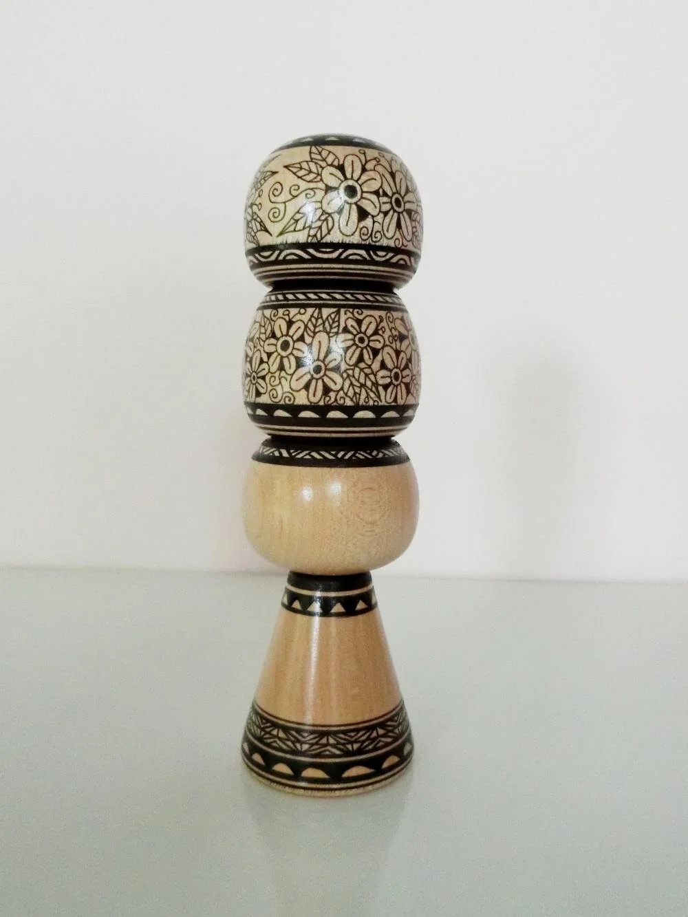 Kokeshi + daruma totem, in monochrome