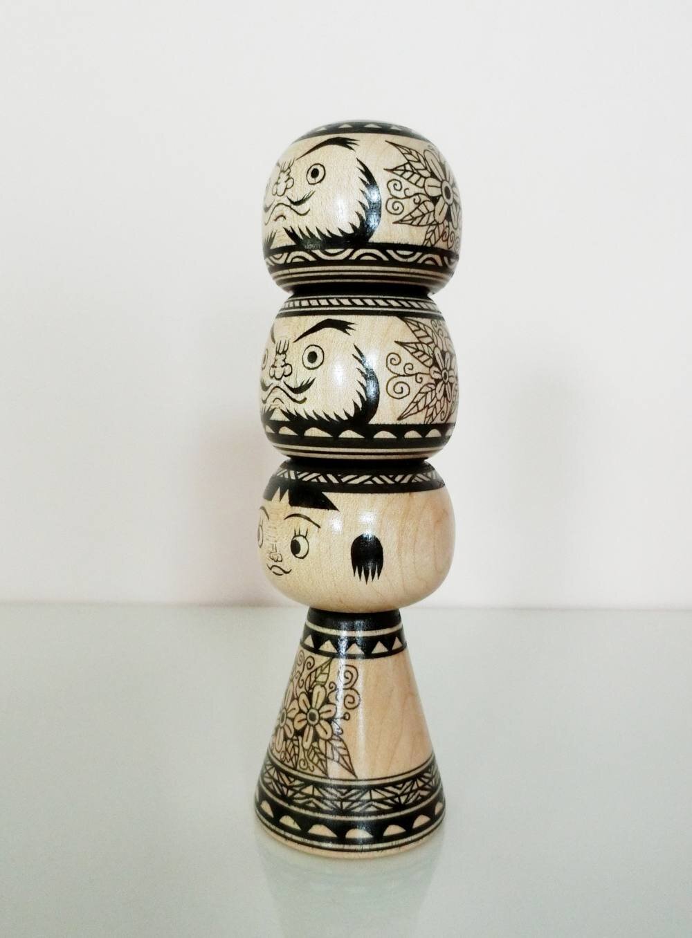 Kokeshi + daruma totem, in monochrome