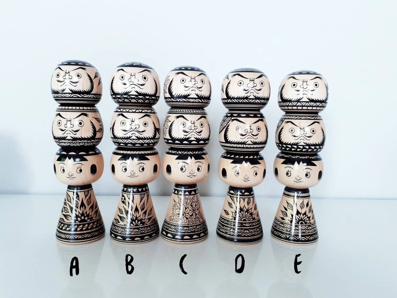 Kokeshi + daruma totem, in monochrome