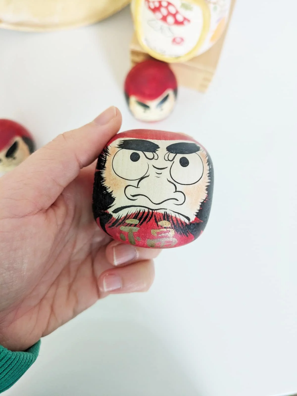 Daruma en bois par Sato Yusuke - au choix